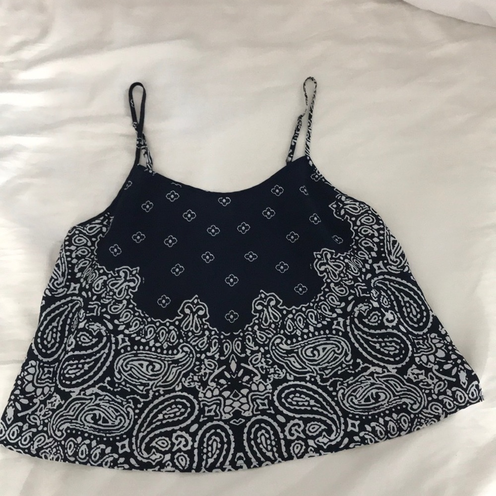 A navy blue blouse with pretty designs.